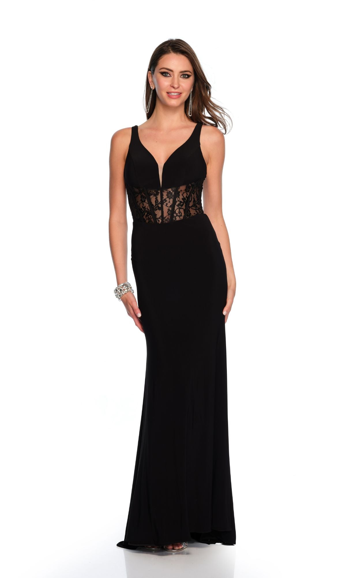 A woman wears the Long Formal Dress 11450 by Dave and Johnny, featuring a black fitted silhouette, sheer lace bodice, and V-neckline, standing against a white background.
